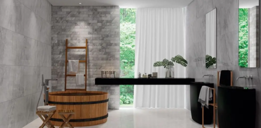 Porcelanato marmorizado: cores, acabamentos e como usar no seu projeto Marmorizado cinza é neutro, mas ganha presença com iluminação direcionada – Foto: Portinari